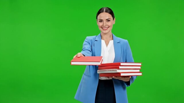 Confident professional woman in blue blazer carries stack of books, ready for presentation or study