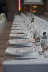 wedding reception dinner table suit set up with decoration flower before evening event start