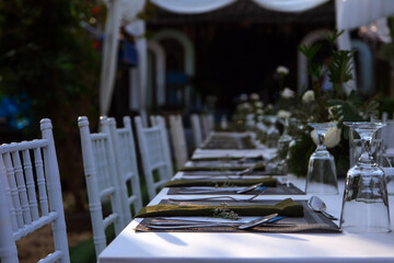 wedding reception dinner table suit at the garden in sunshine before event start