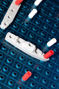 Close up of strategic battleships board game with ships and pegs