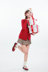 Joyful Asian Woman in Santa Hat Holding Christmas Presents with Gift Box for Year-End Sale Promotion.