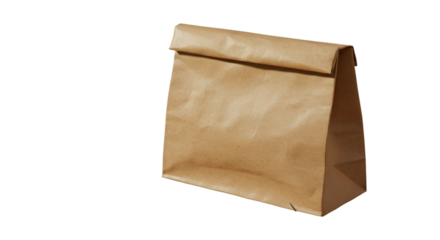 A humble brown paper bag stands ready holding secrets of a simple lunch a quiet moment of sustenance in stark isolated