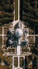 Bird's-eye view of a grand, symmetrical chateau featuring a prominent dome, surrounded by formal gardens and lush, autumnal trees. Straight walkways radiate