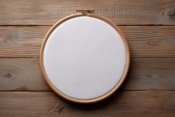 Embroidery Hoop on Wood: A top-down view captures the essential tools of embroidery: a wooden hoop against a warm, rustic backdrop of a wooden surface.