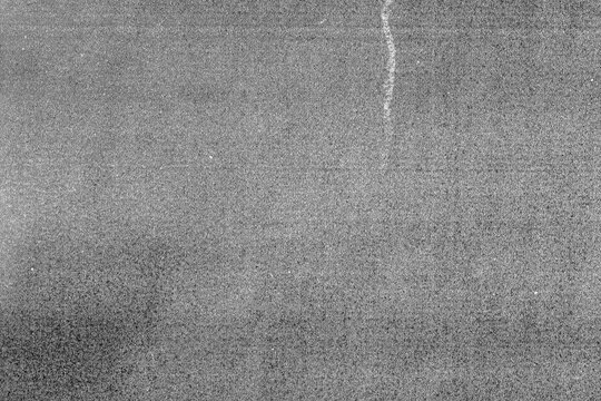 Abstract black and white grunge distressed texture background,texture overlay effects of bad photocopySmudged Scanner,black and white grainy background with dust and scratch