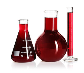 Laboratory glassware with red liquid isolated on white