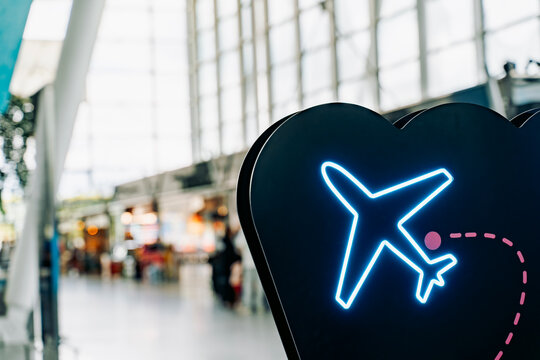 Airport neon airplane sign with travel route