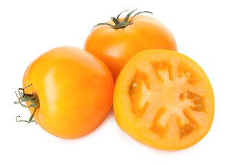 Whole and cut yellow tomatoes isolated on white