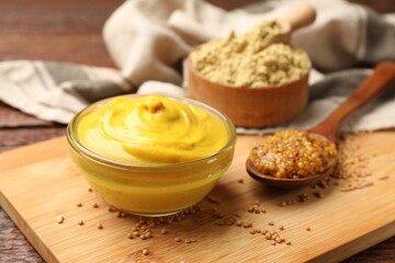 Different types of mustard on table, closeup