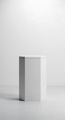 Minimalist white rectangular object with subtle shadows on a light surface