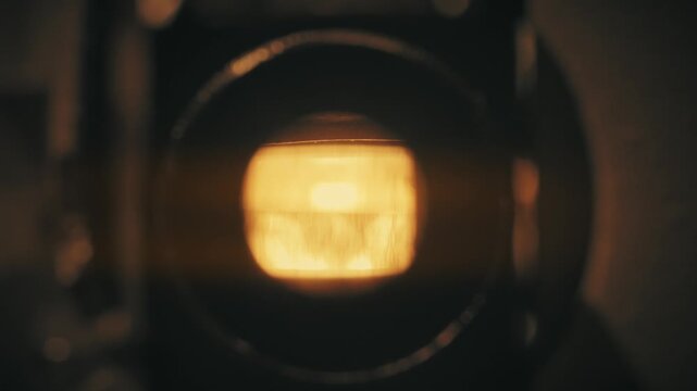 Lens of an old movie projector in close up view - macro shot