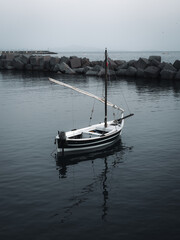small boat in dark water