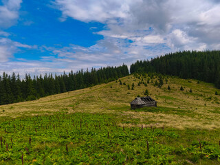 mountain landscape with abandoned house