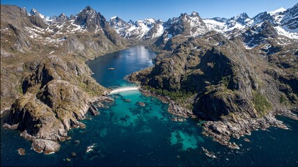 Mountain Lake Scene Surrounded by Snow Capped Peaks and Rocky Cliffs