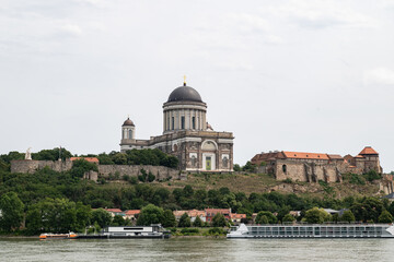 Fototapeta premium The majestic Esztergom Basilica rising on a hill along the banks of the Danube River. Historical and natural beauties of Hungary.