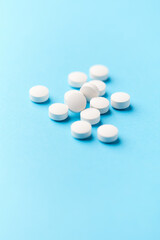 Hyaluronic acid tablets. Hyaluronic acid helps skin stretch and flex and reduces skin wrinkles. Bright paper background. Soft focus. Close up. Copy space	