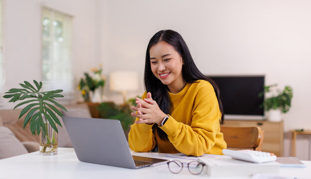 Asian woman using computer remote for business studying, watching online virtual webinar training meeting, video call. asian business woman talking on laptop in home office. Banner, copy space
 - Powered by Adobe