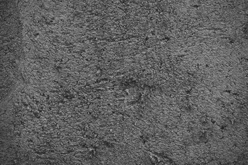 Dark and Heavily Textured Concrete Surface, with a Rough and Gra