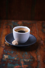Cup of coffee on rustic wooden background. Soft focus. Copy space	