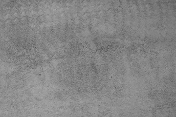 Weathered Gray Concrete Surface with a Distinct Wavy Pattern, Cr