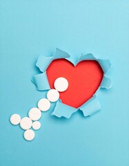 Heart-shaped hole with pills