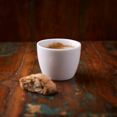 Cup of coffee on rustic wooden background. Soft focus. Copy space	