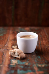 Cup of coffee on rustic wooden background. Soft focus. Copy space	