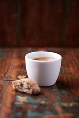 Cup of coffee on rustic wooden background. Soft focus. Copy space	