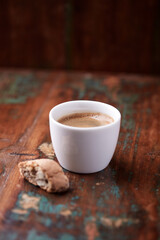 Cup of coffee on rustic wooden background. Soft focus. Copy space	