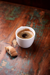 Cup of coffee on rustic wooden background. Soft focus. Copy space	