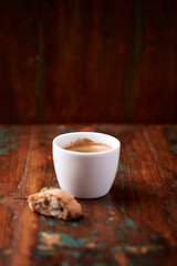 Cup of coffee on rustic wooden background. Soft focus. Copy space	