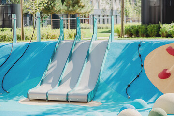 Playground with three slides for children, recreational area