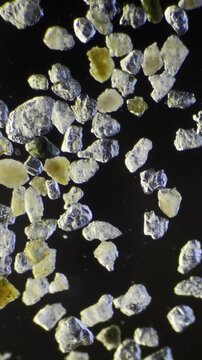 Sand grains under dark-field microscopy at 40x Magnification