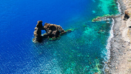 Roque de Bonanza is one of the symbols of El Hierro island and its natives. Huge Rock sticking out of the water on the las Almorranas beach. El Hierro, Canary islands Spain.