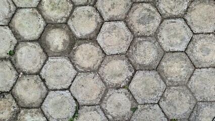 Small Stone Paving Road with Worn Texture, Grunge Detailed Background for Wallpaper or Backdrop Use