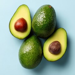 A close-up shot showcases fresh, vibrant avocados, one sliced open to reveal its seed