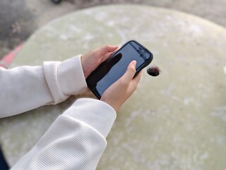 Person holding a smartphone in their hands