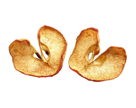 Two dried apple slices, heart-shaped, facing outward, on a black background.  The slices show a light golden-brown color with a reddish-brown edge.  A core is visible in the center of each