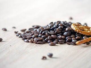 Roasted coffee beans close-up - Coffee beans on a wooden table - A detailed macro shot of high-quality roasted coffee beans scattered across a dark wooden table