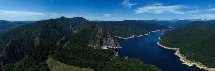 Fototapeta premium Aerial drone panorama view of Vidraru dam and lake in Fagaras mountains, Romania.
