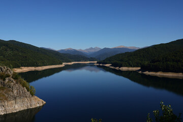 Aerial drone panorama view of Vidraru lake in Fagaras mountains, Romania.