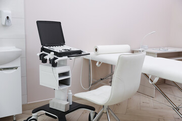 Modern ultrasound machine and examination bed in clinic