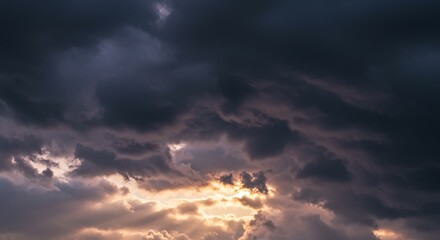 Obraz premium Dramatic sky panorama, captivating contrast between darkness and light with emerging golden sunrays