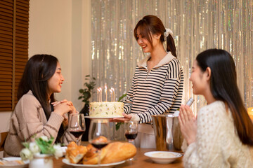 Birthday Celebration with Friends Young Adult Women Enjoying Cake Candles and Wine Creating Happy Moments Together Special Occasion