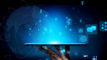 A hand holds a glowing tablet surrounded by various digital icons, symbolizing the advancements in...