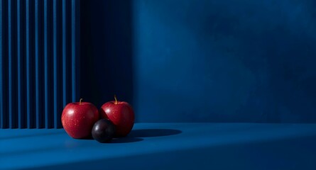 Modern Minimal Blue Background with Fresh Organic Apple Plum and Healthy Food Theme.