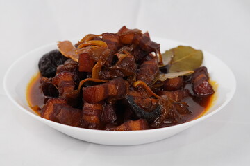 Braised pork belly with mushrooms and caramelized onions