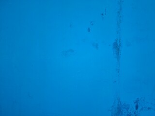 Textured Blue Surface with Faint Scratches and Discoloration for Abstract Background