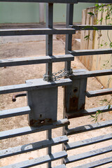 Rusty chain on an old iron gate.