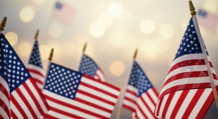 A collection of small American flags with a festive, glowing bokeh background for a national holiday.